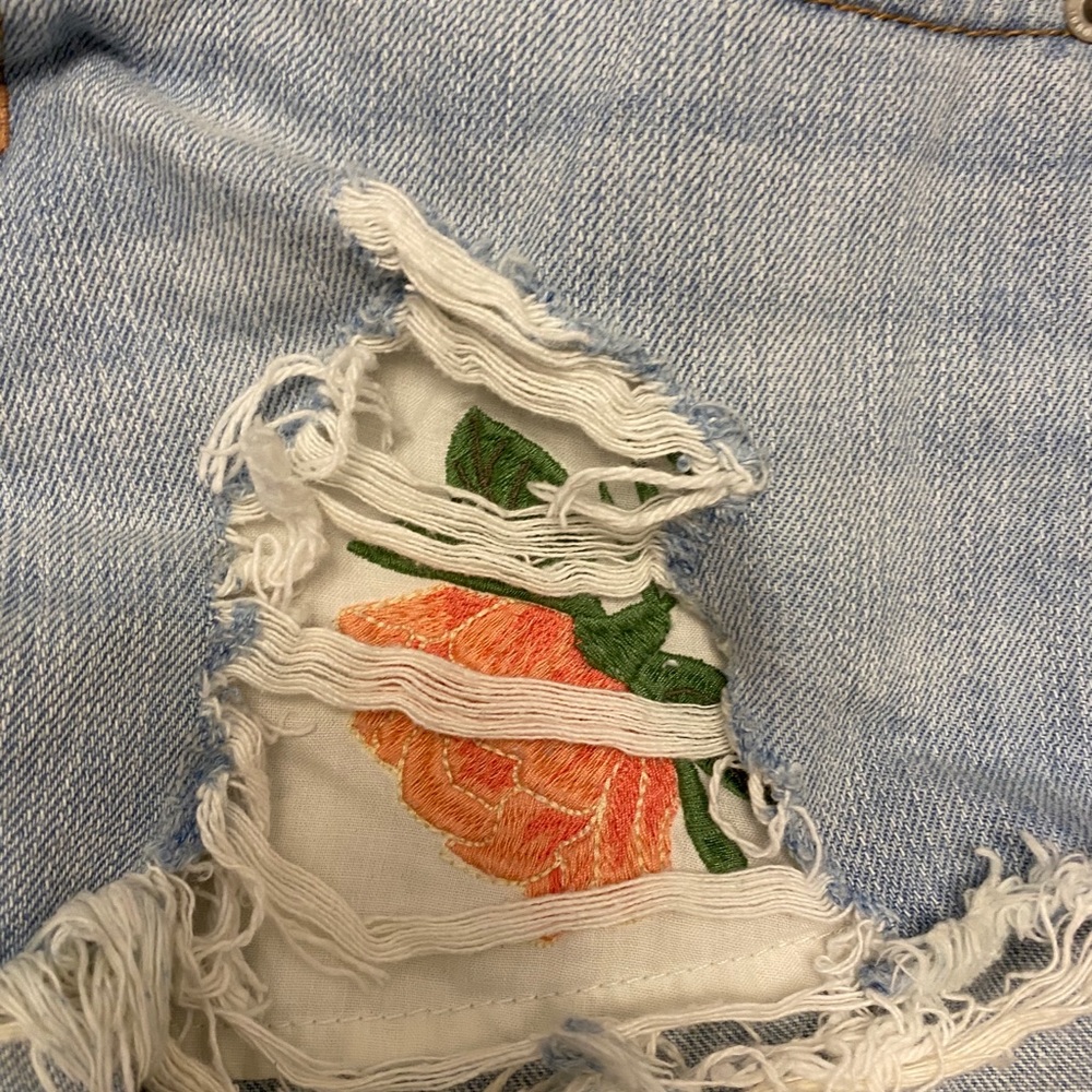 Denim shorts with peek a boo flower pockets